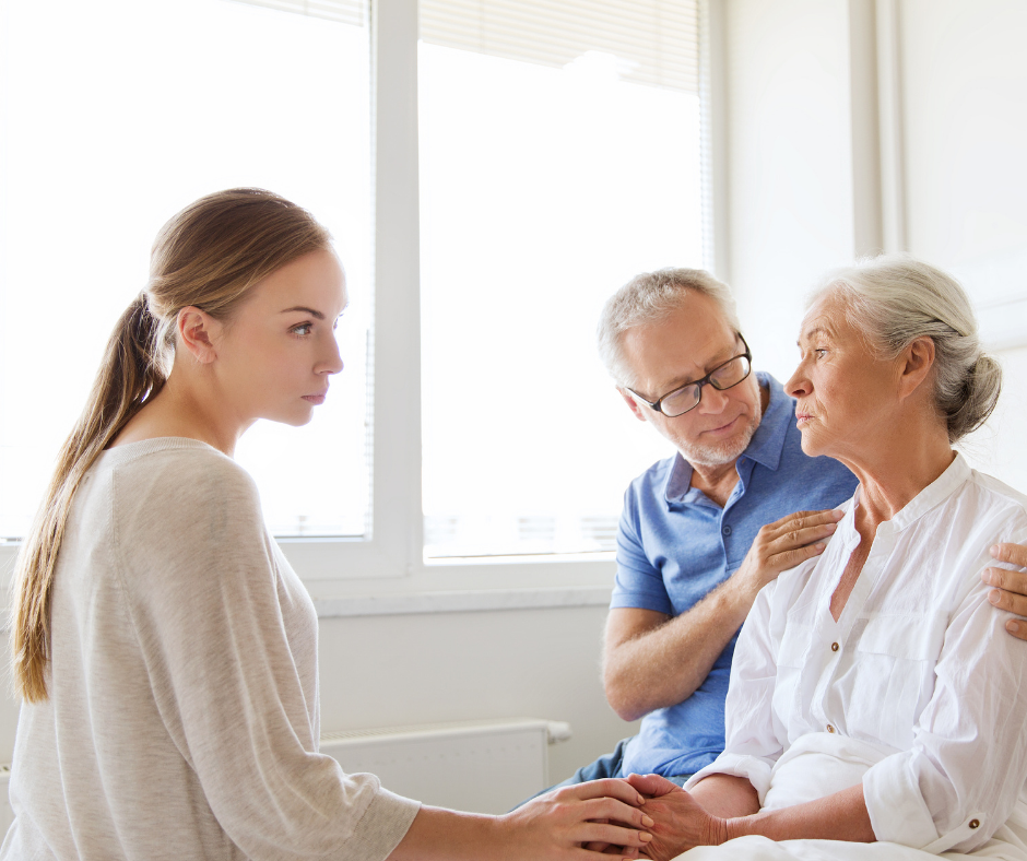 Professional woman visiting elderly mom in assisted living, hospital or nursing home.